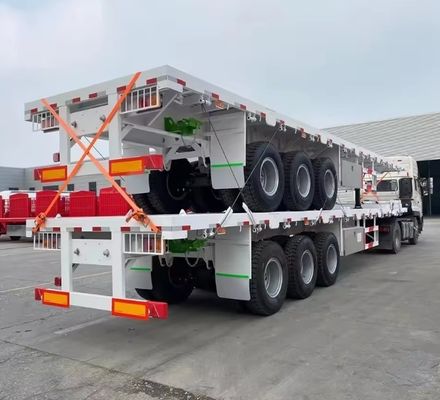90T de acero de carga útil máxima 20FT 40FT contenedor de semirremolque de cama plana con neumático 12r22.5