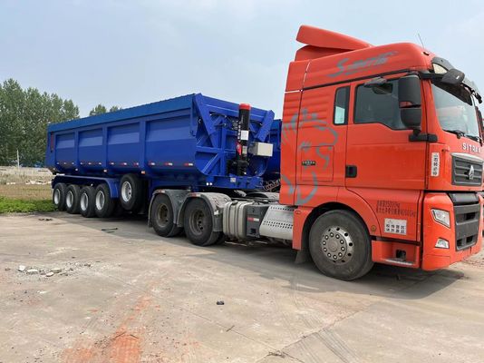 4 Ejes Semi remolque hidráulico trasero con extremo de descarga con inclinación para el transporte de grano de piedra arenisca