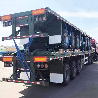 4 Ejes 20FT 40FT Semi remolque de camión de cama plana Contenedor Semi remolque con neumáticos 12R22.5